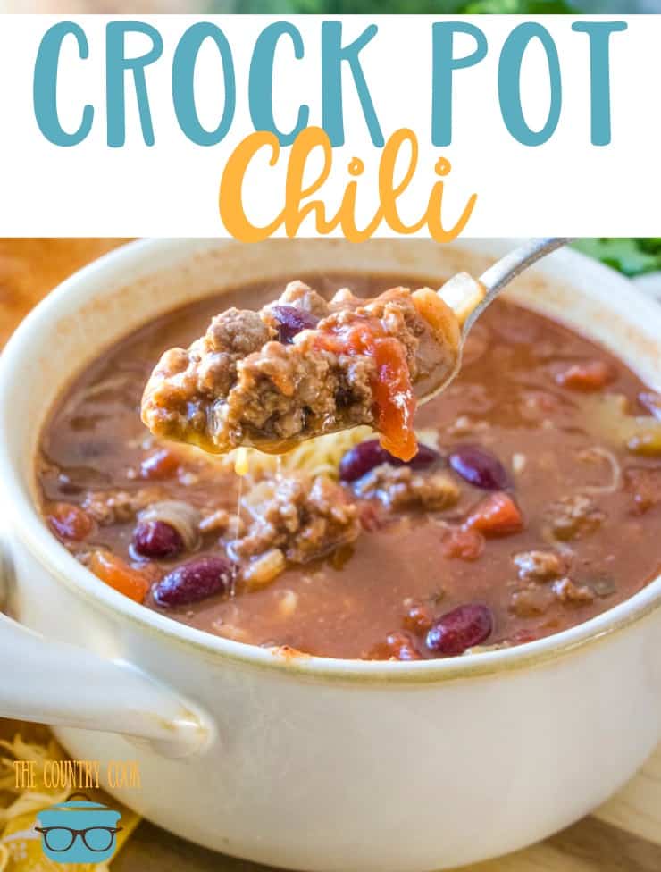 The Best Crock Pot Chili recipe from The Country Cook. A white bowl filled with chili and a spoon shown scooping up a small amount. 