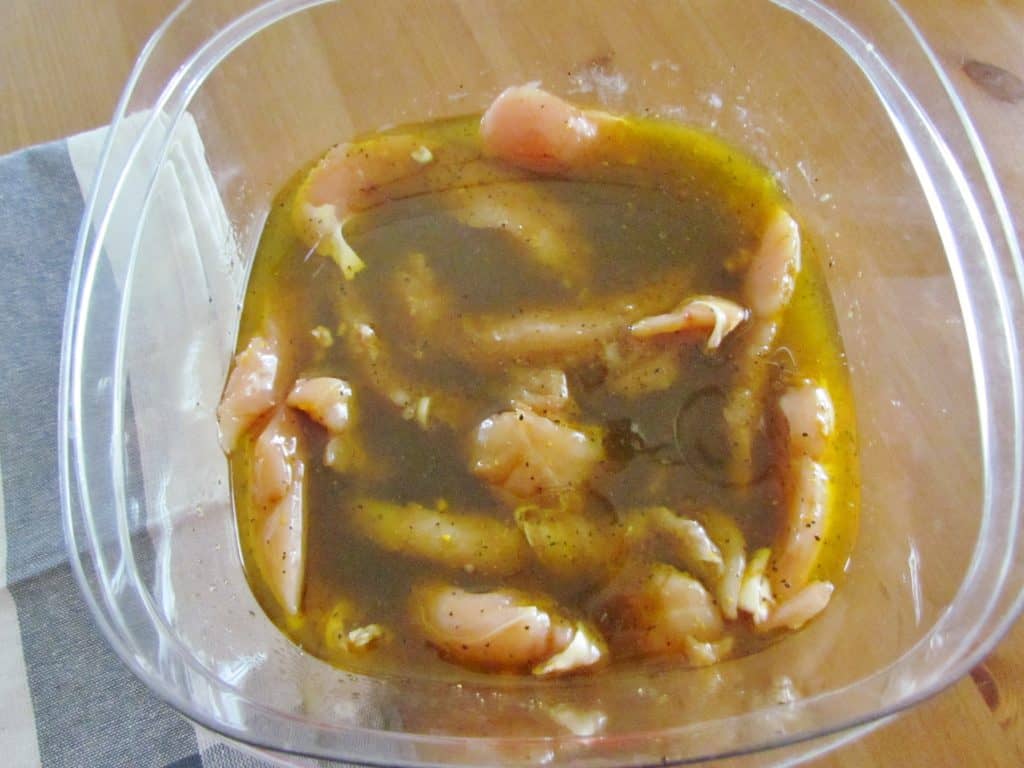fully coated chicken breast in marinade