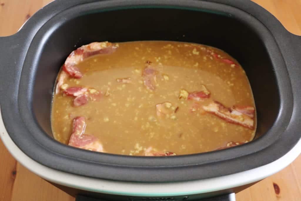 bone-in pork chops smothered in gravy in a slow cooker