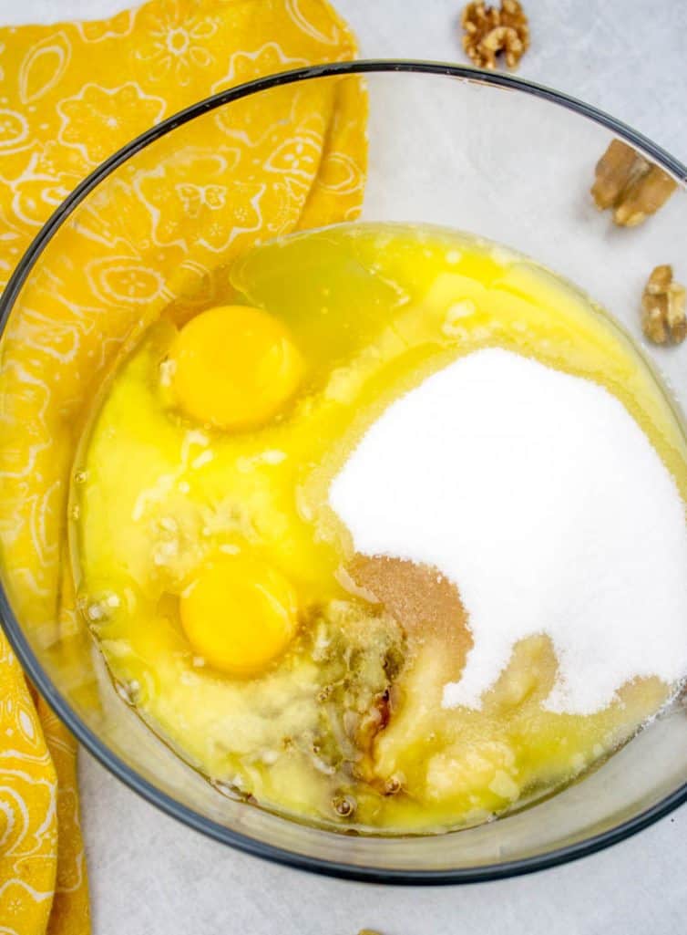 mashed bananas, eggs, sugar, vanilla extract in a large mixing bowl