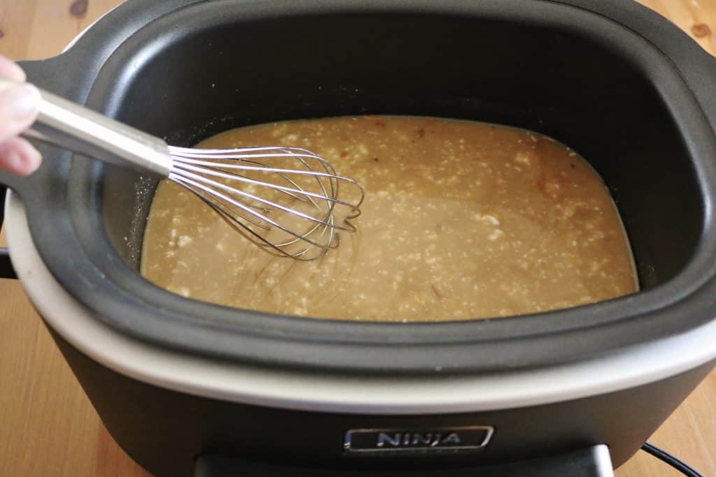 dry onion soup mix, beef broth, cream of mushroom soup whisked together in a slow cooker.