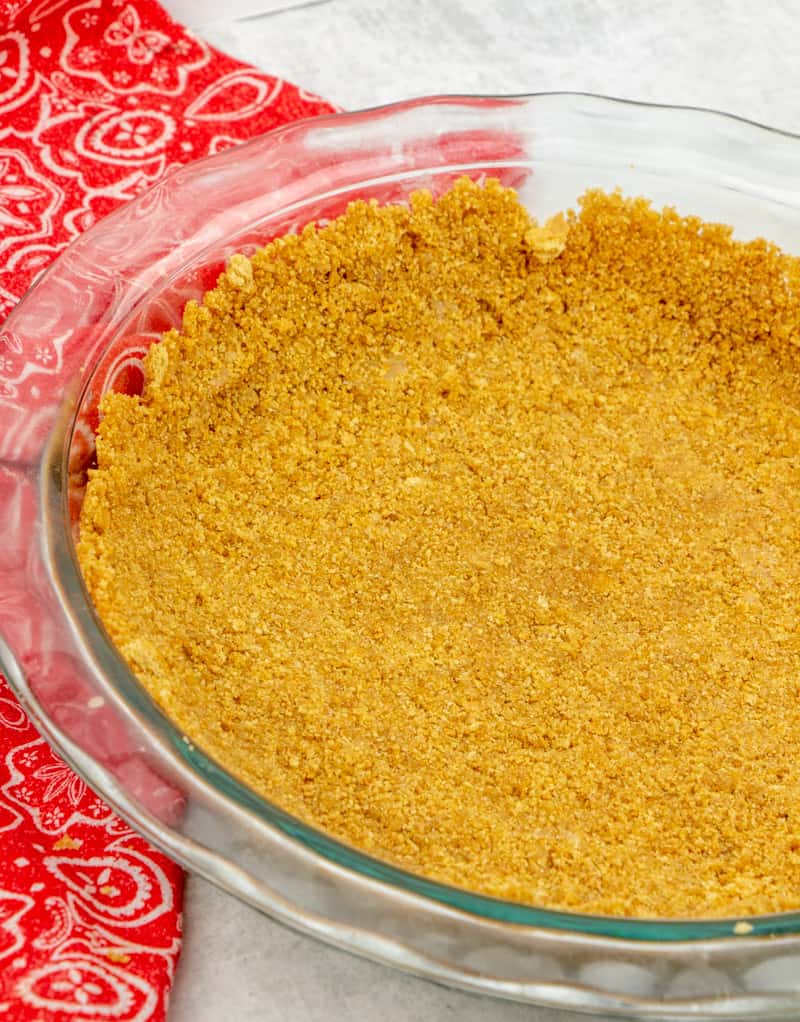 homemade graham cracker crust pressed into the bottom of a Pyrex  pie dish.