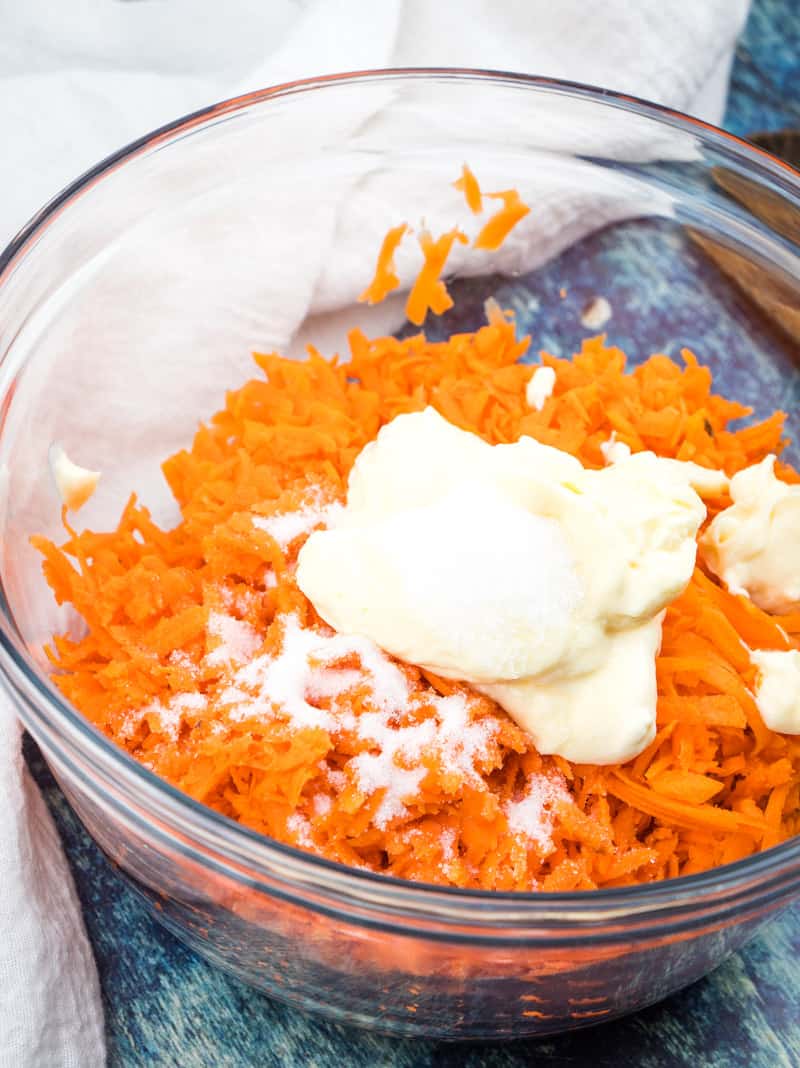 mayonnaise and sugar added to carrot salad