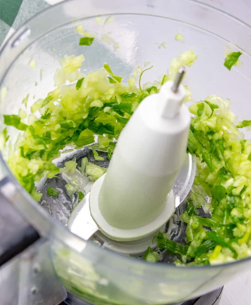 coarsely chopped green onion and cucumber in food processor