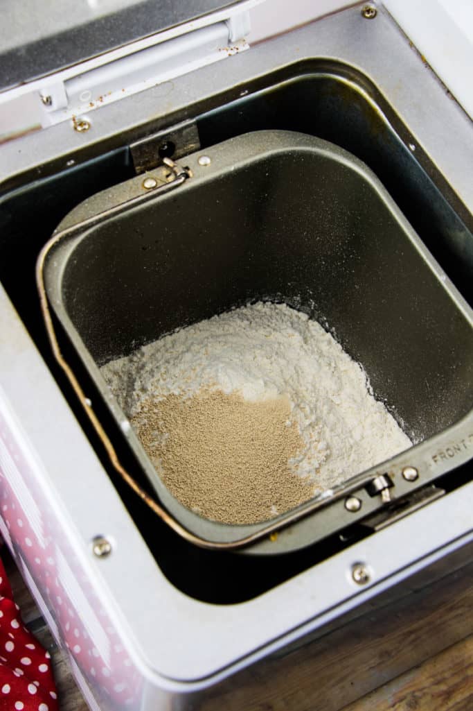 warm water, flour, yeast and salt added to the insert of a bread making machine.