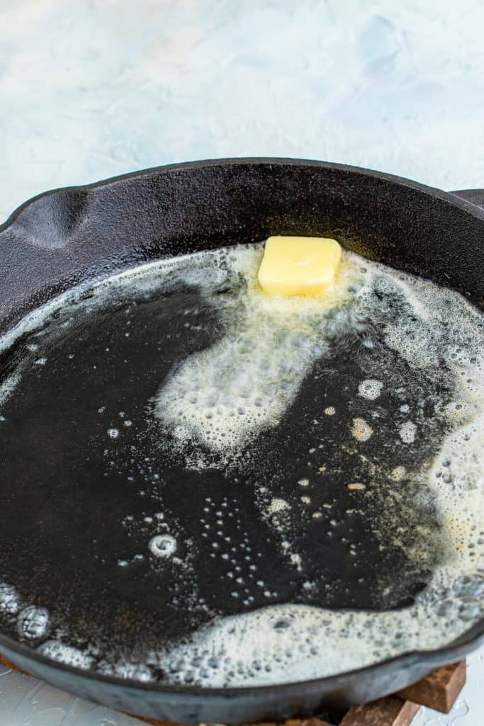butter melted in a cast iron skillet.