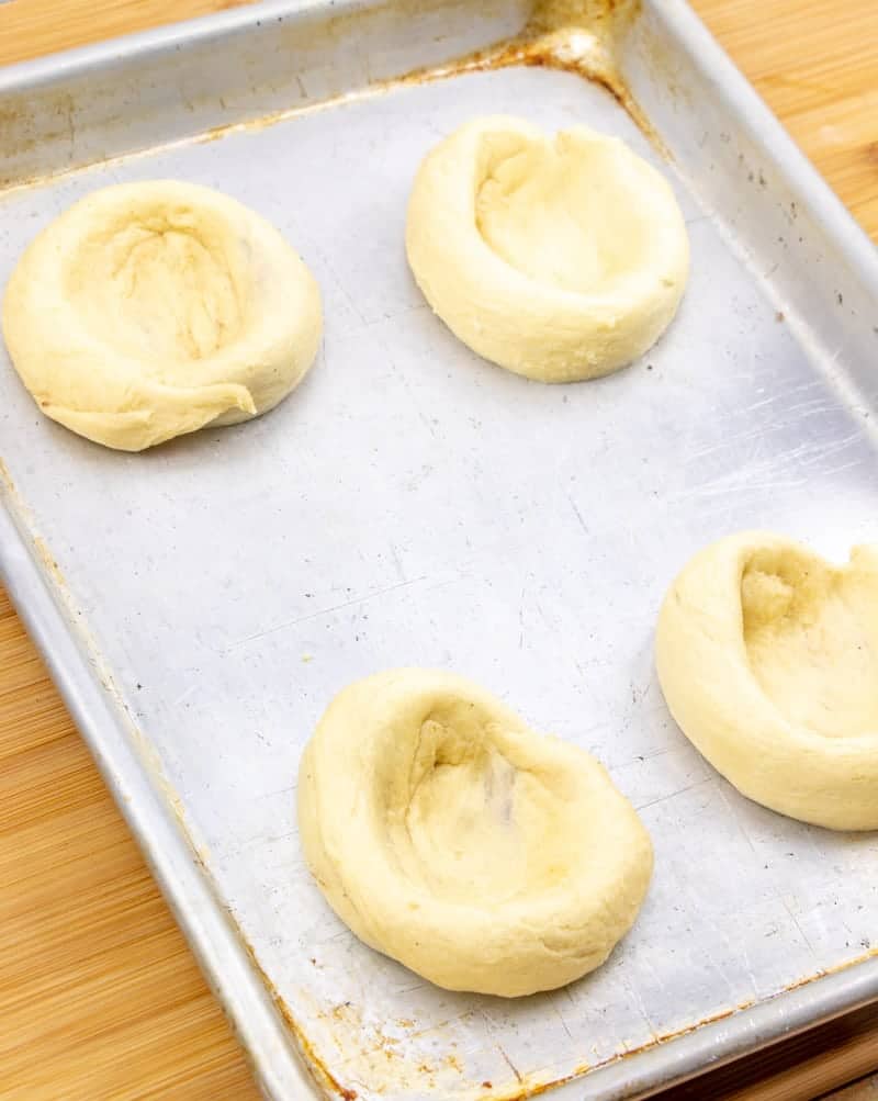 crescent roll danish dough spread apart on baking sheet.