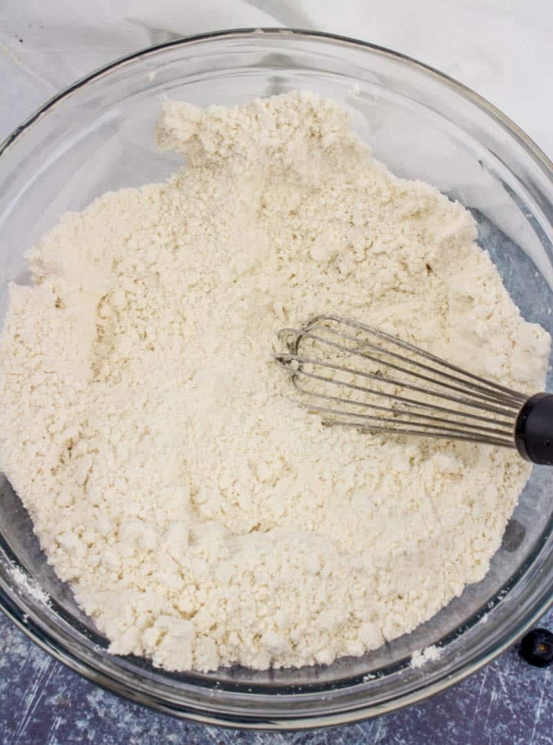 Bisquick biscuit mix and sugar whisked together in a bowl.