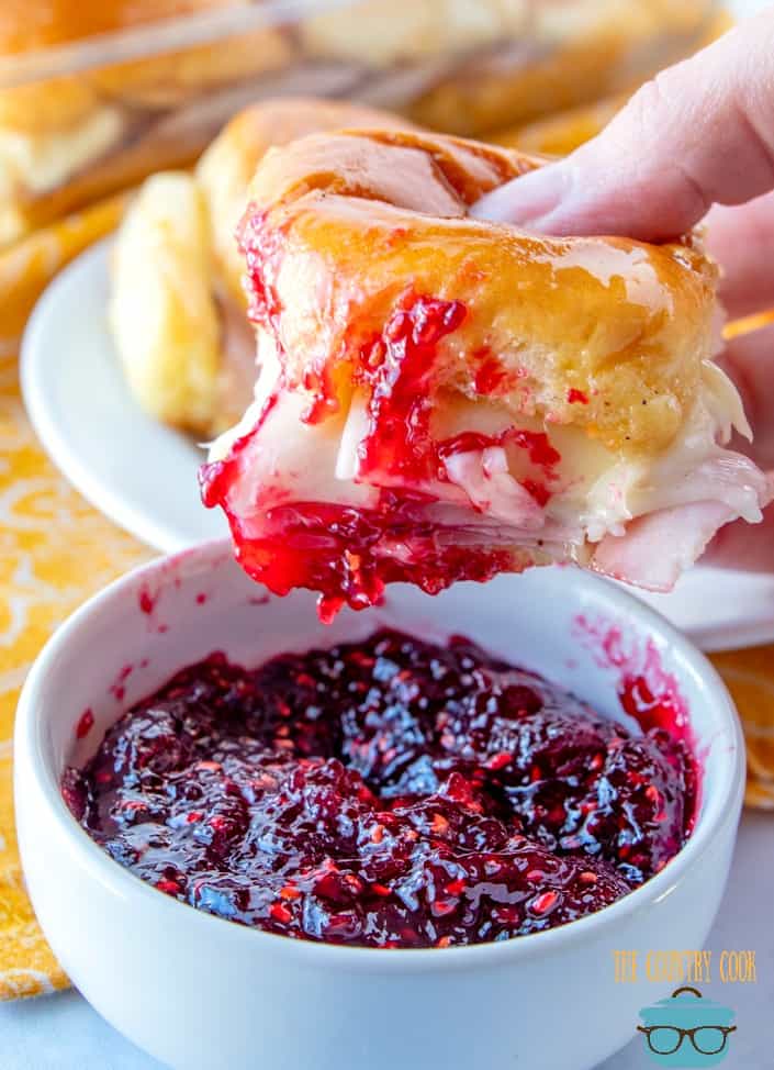 Glazed Ham and Cheese Rolls dipped in raspberry jam.