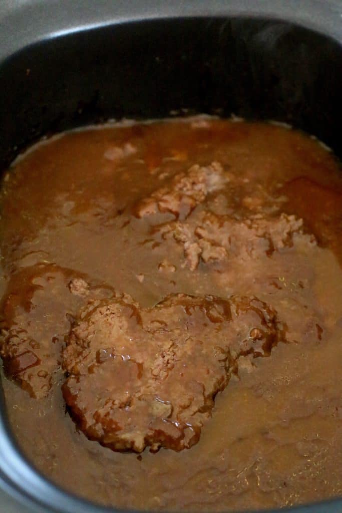 thickened gravy and cooked cubed steak in a slow cooker