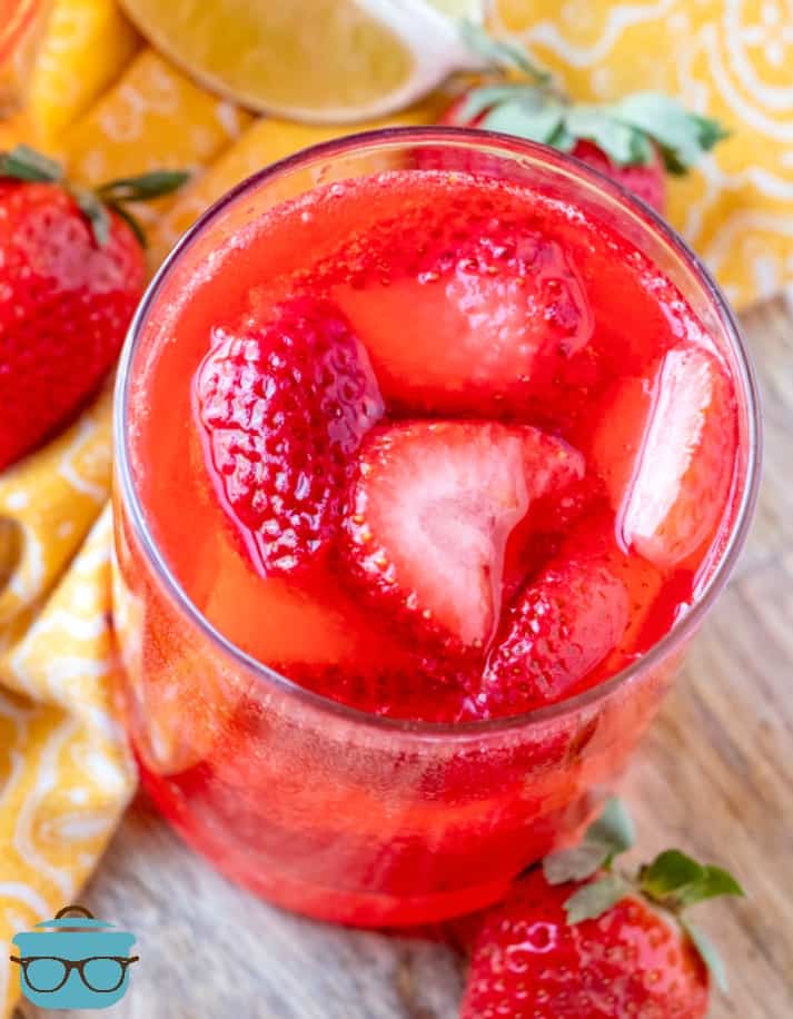 Sparkling Strawberry Punch topped with fresh strawberries.