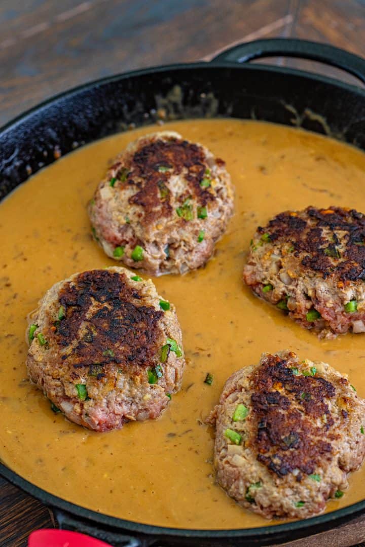 browned hamburger patties back into gravyy mixture in a cast iron skillet. 