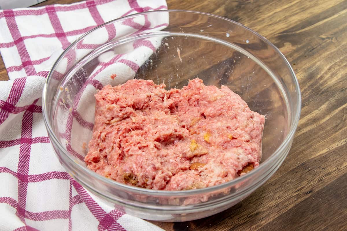 meatloaf mixture combined in a glass bowl.
