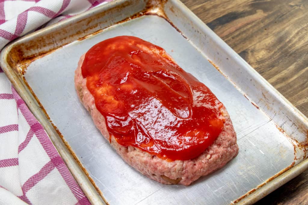 spread ketchup on top of meatloaf before baking