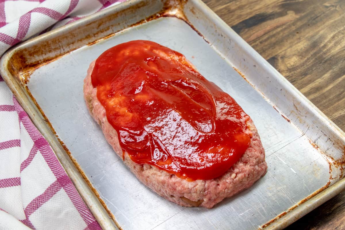 spread ketchup on top of meatloaf before baking.