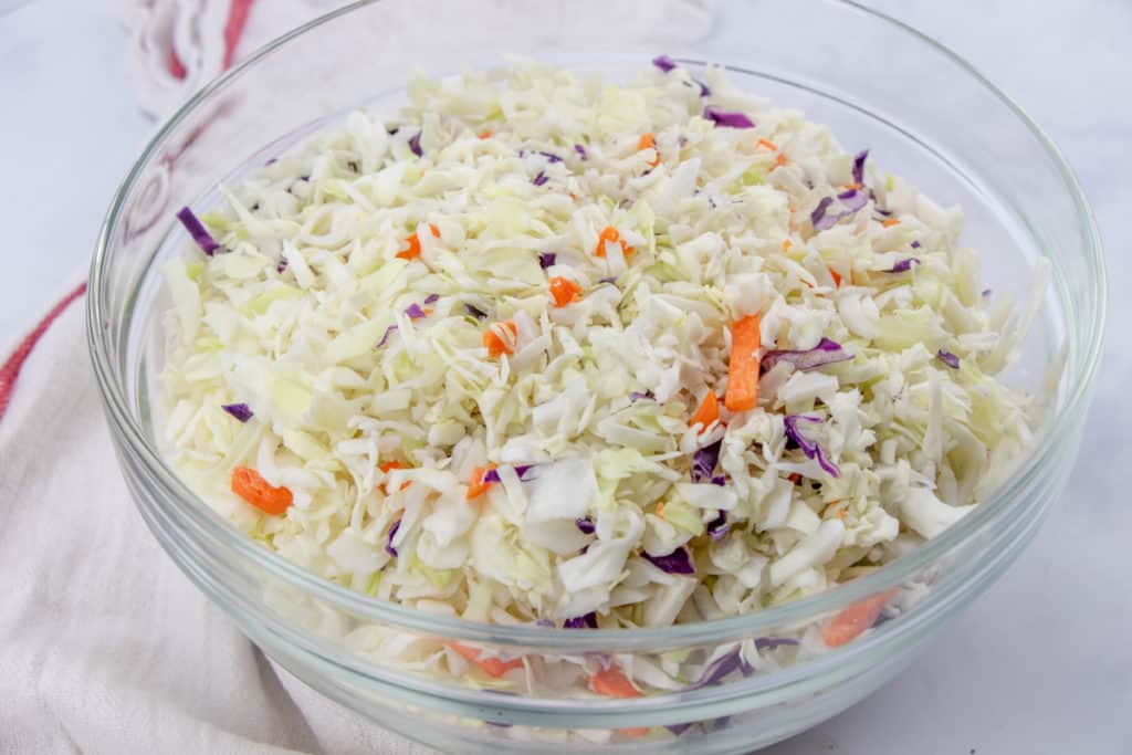 shredded cabbage and carrot Cole slaw mix in a large bowl