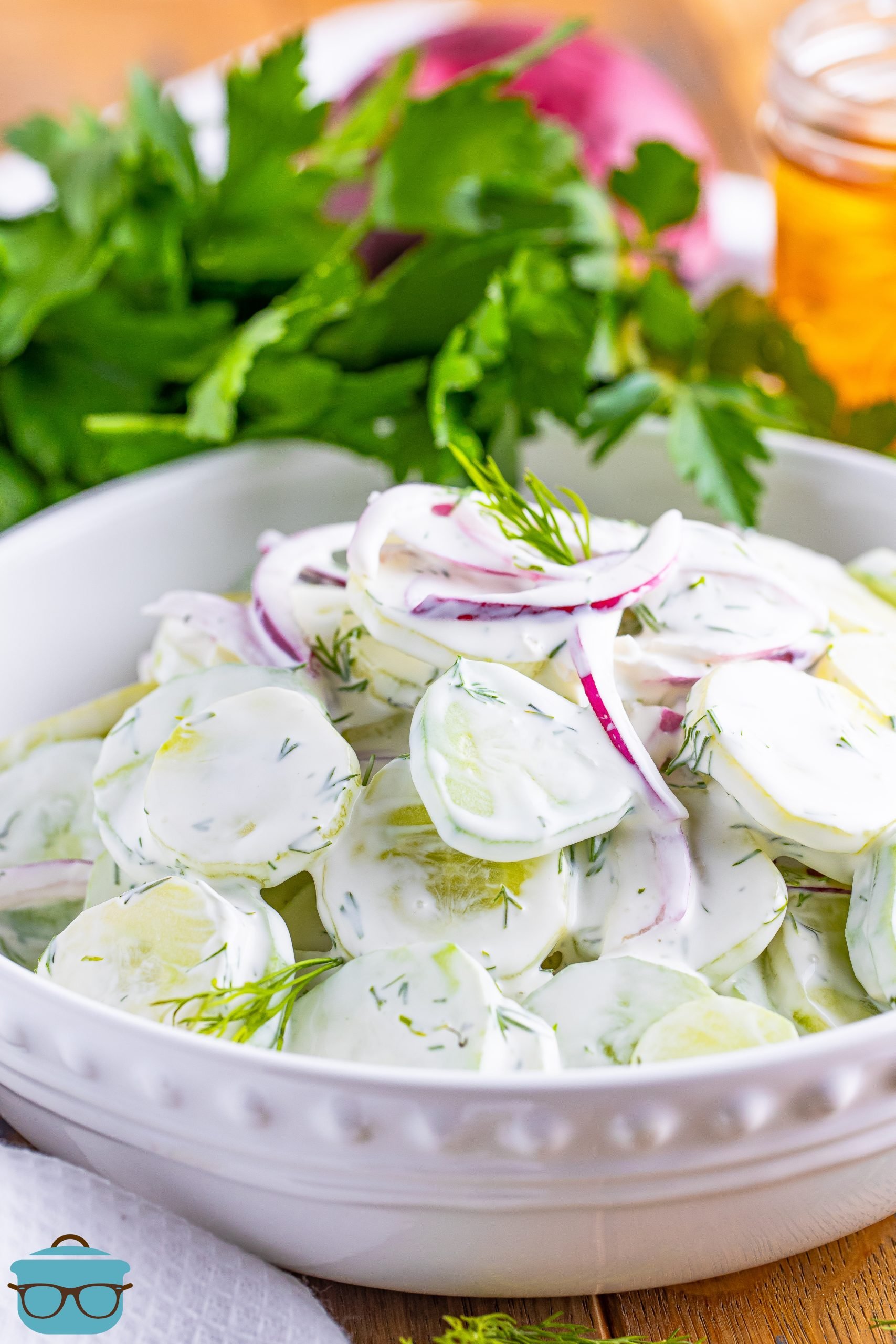 A bowl of Creamy Cucumber Salad with fresh dill.