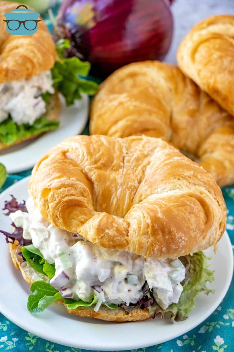 The Best Chicken Salad served on a fresh croissants on small white plates.