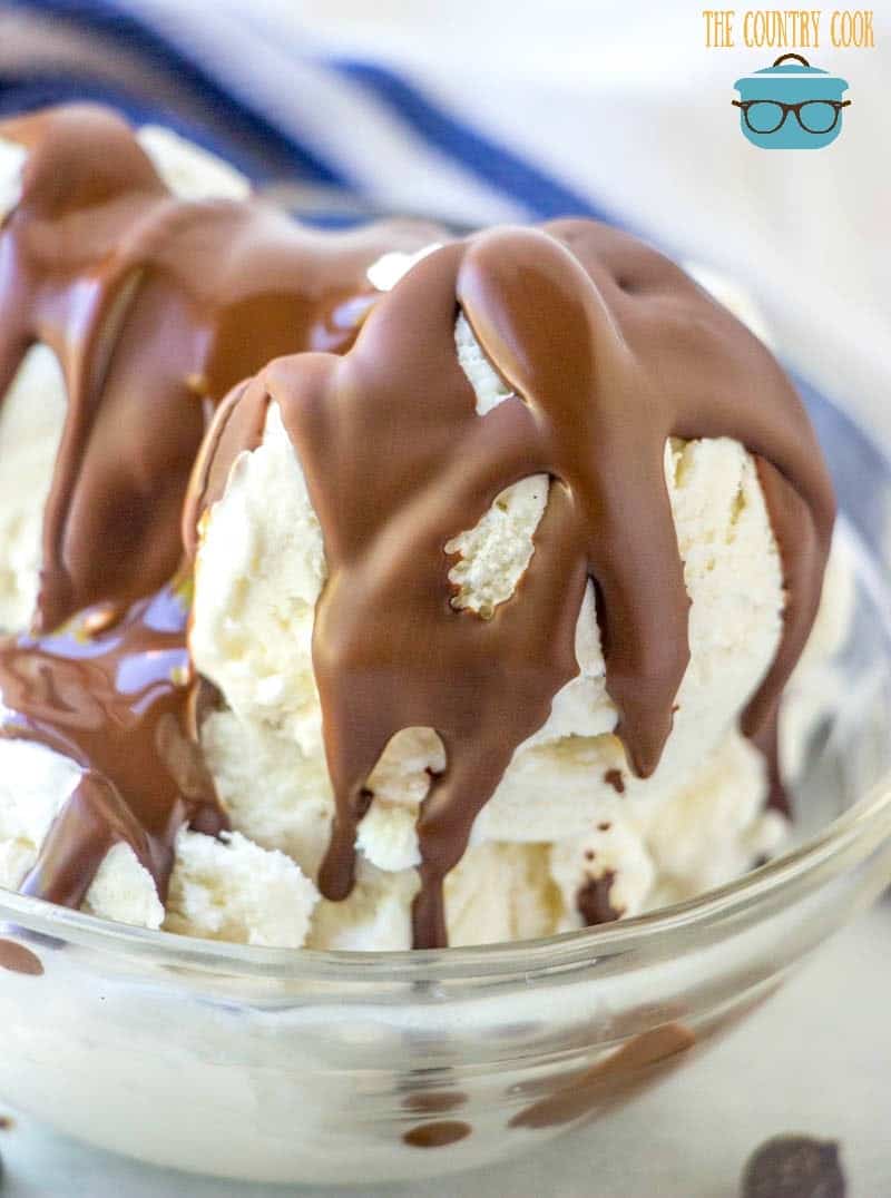 chocolate magic shell drizzled over vanilla ice cream in a small clear bowl.