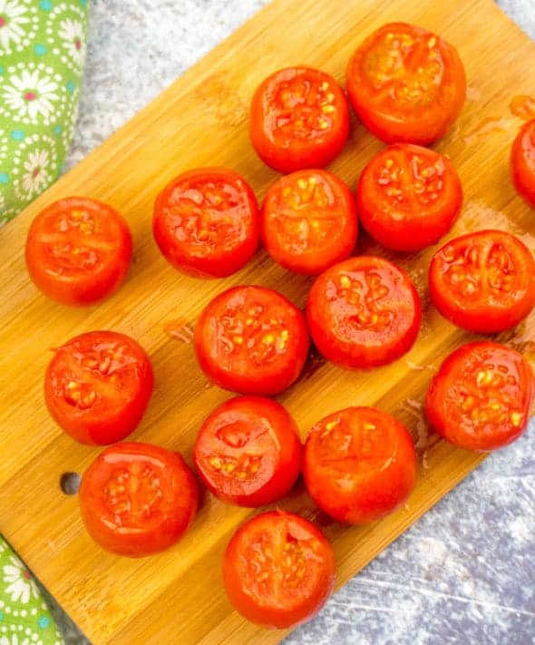 tops cut off cocktail (cherry) tomatoes.