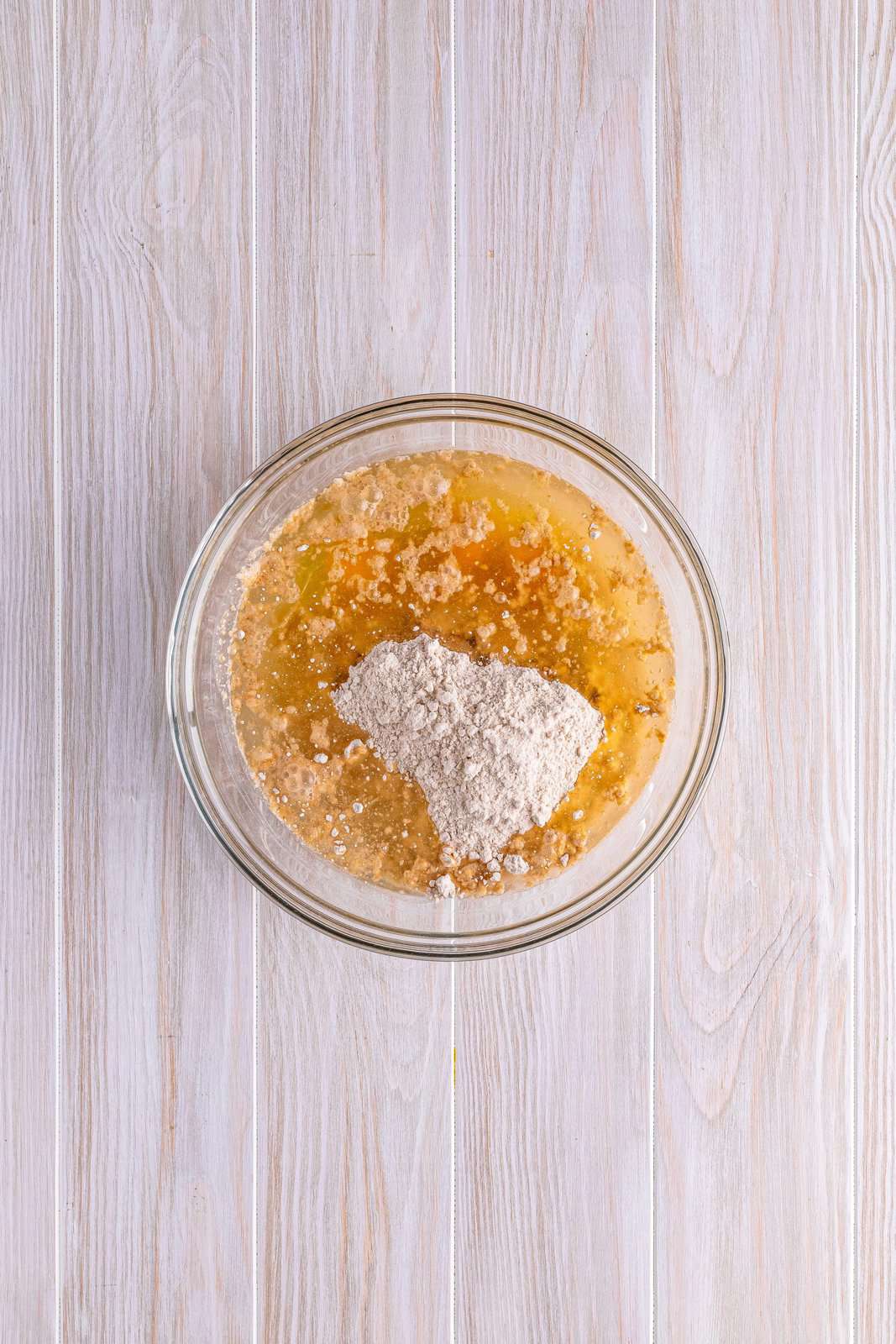 spice cake mix with oil, eggs and water in a clear bowl. 
