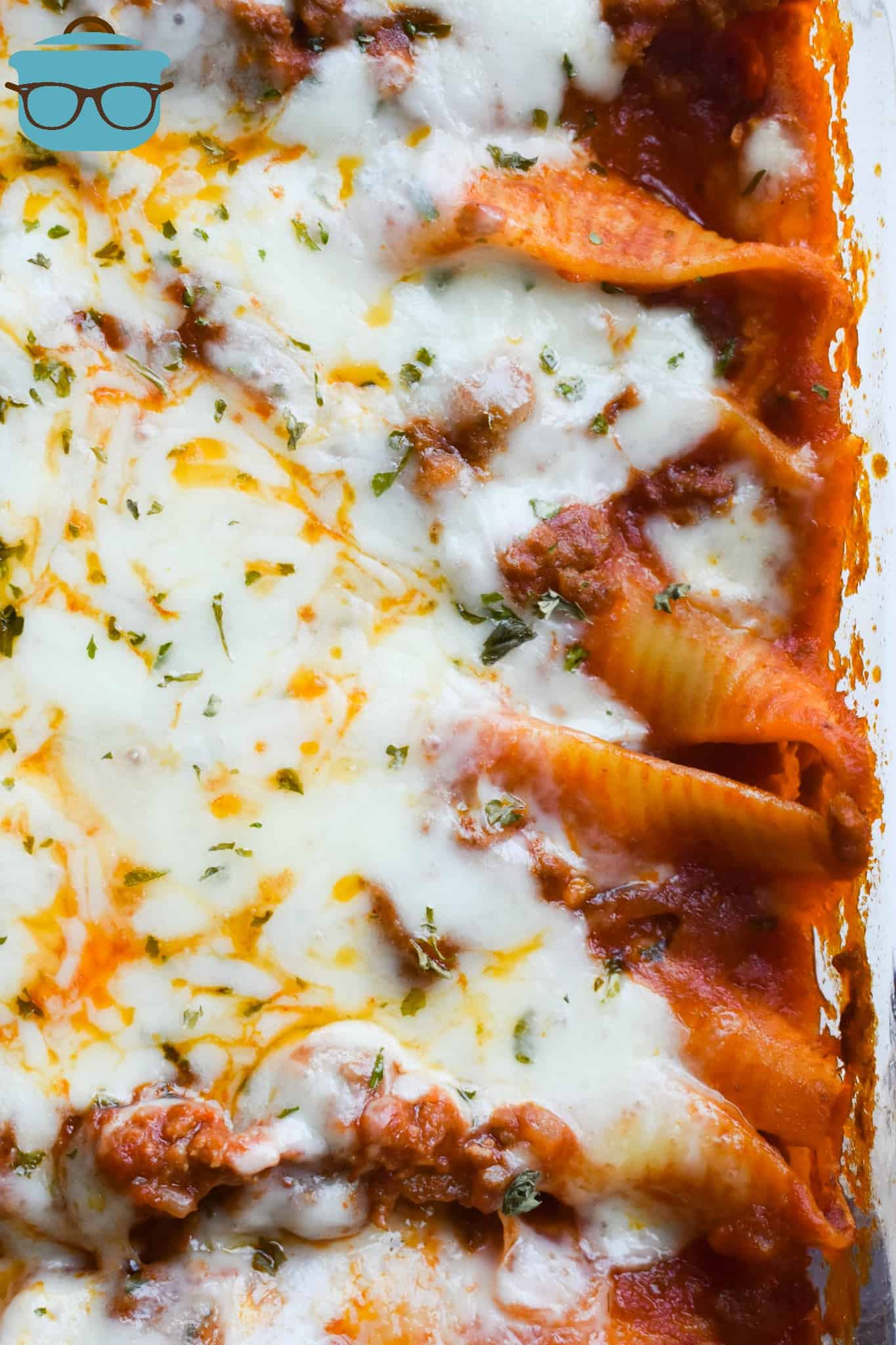 Stuffed Shells in a baking dish, fully baked with melted cheese on top.