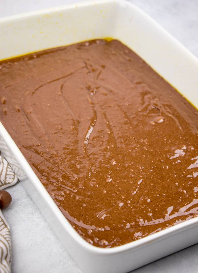 chocolate cake batter in baking dish.