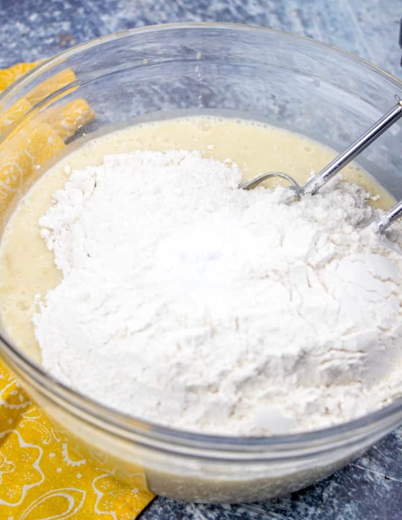 all purpose flour and baking soda added to banana cake batter