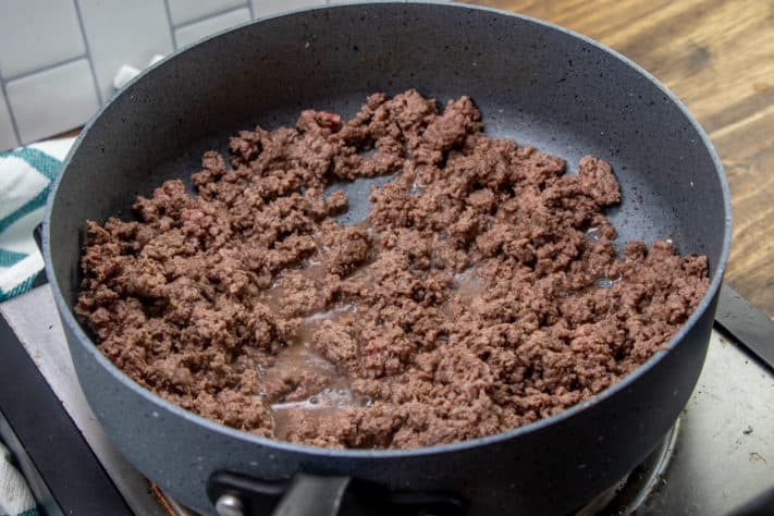 cooked and crumbled ground beef in a sauce pan