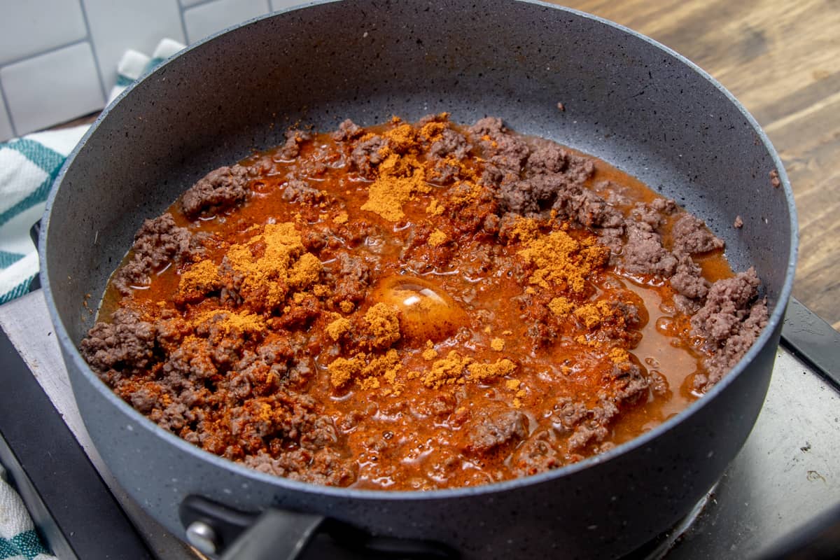 taco seasoning and water added to cooked ground beef.