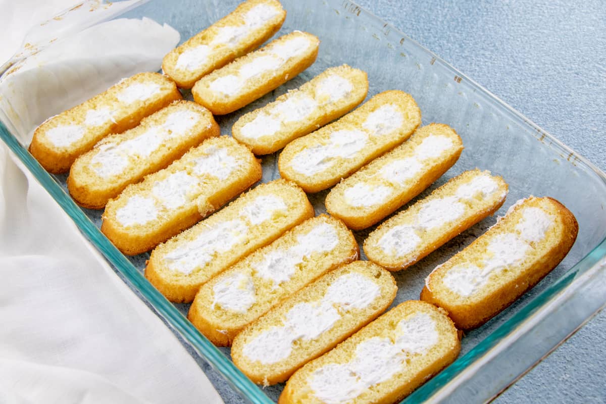 cream side up sliced Twinkies in a 9X13 baking pan.
