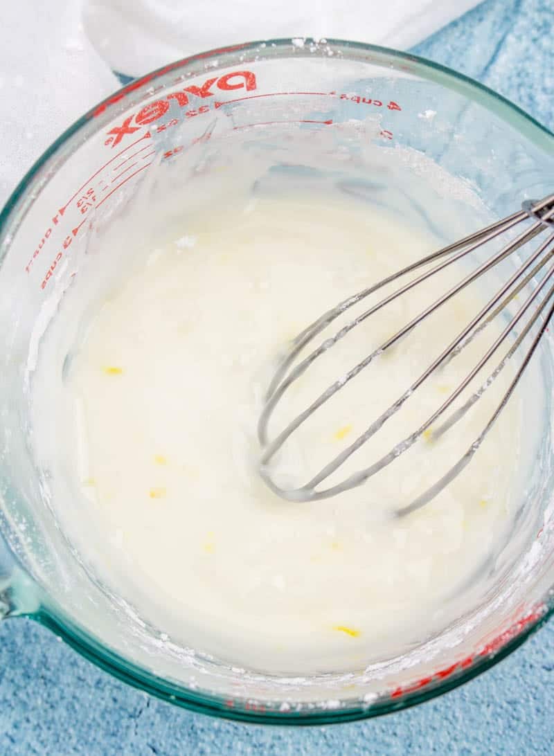 milk added to powdered sugar and lemon zest, whisk together in a measuring cup.