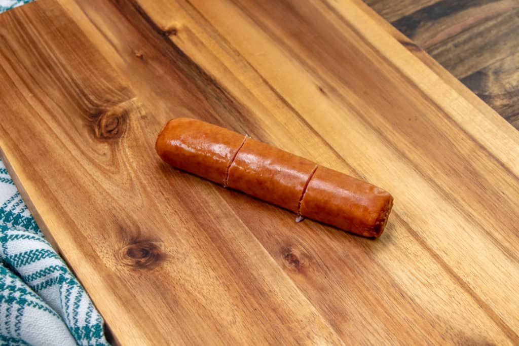 sliced bratwurst on a cutting board
