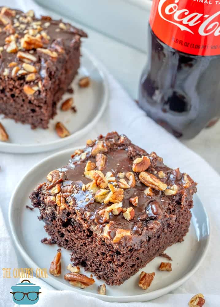 Coca Cola Cake, slices on a plate with a bottle of Coca Cola in the background.