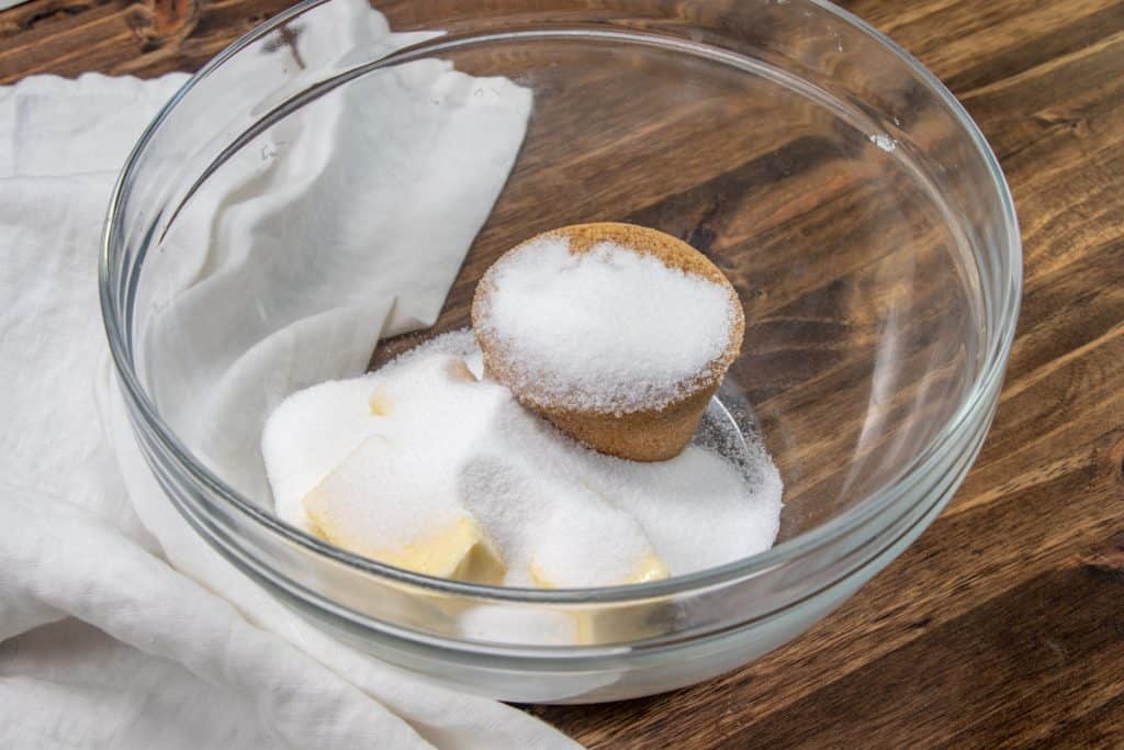 brown sugar, softened butter and sugar in a clear bowl