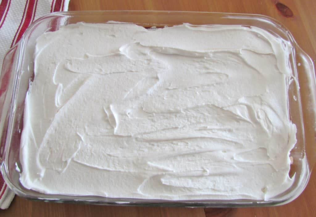 Cool Whip whipped topping spread on top of layered dessert