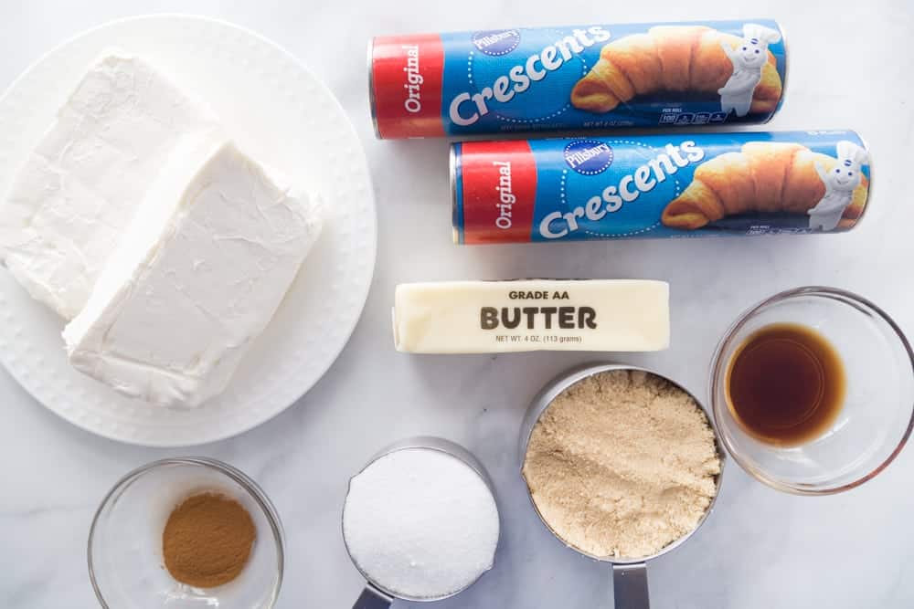sopapilla cheesecake bar ingredients: crescent rolls, sugar, butter, cinnamon, vanilla extract, cream cheese