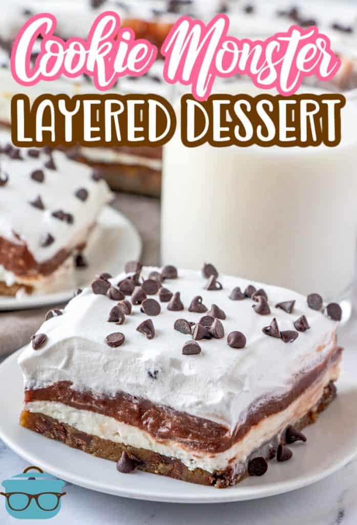 Cookie Monster Layered Dessert recipe from The Country Cook, slice shown on a small white plate with a clear glass of milk in the background