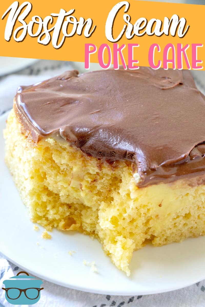 Boston Cream Pudding Poke Cake recipe from The Country Cook. Closeup photo of a slice of cake with a bite removed.