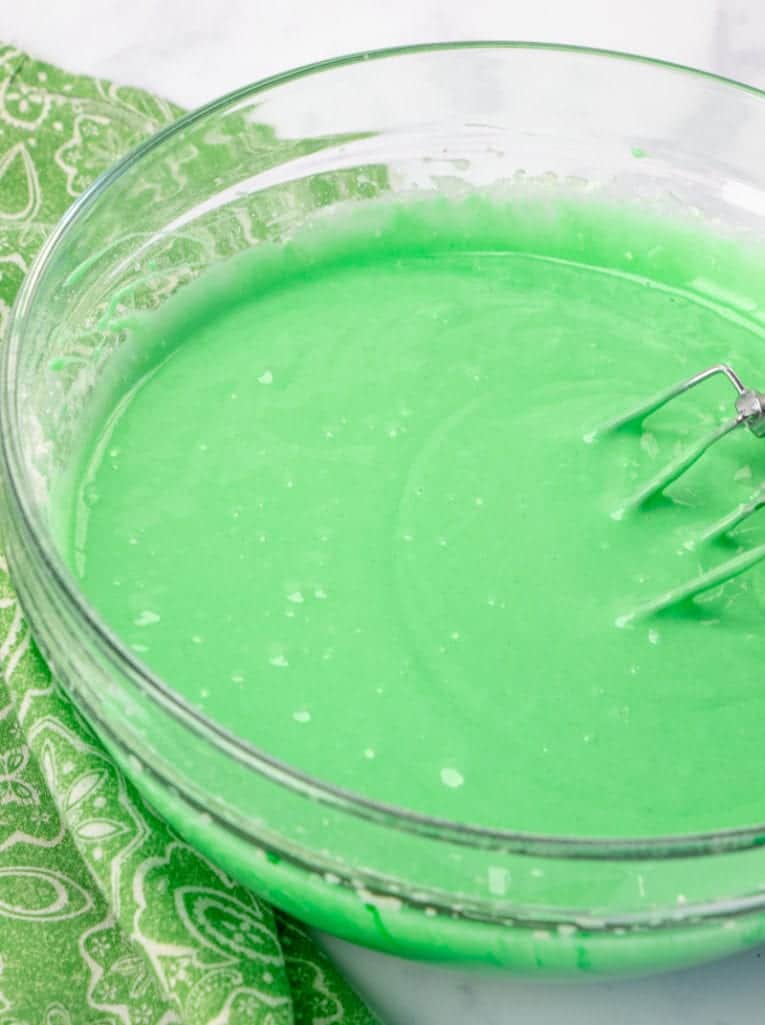green food coloring added to batter with an electric mixer.