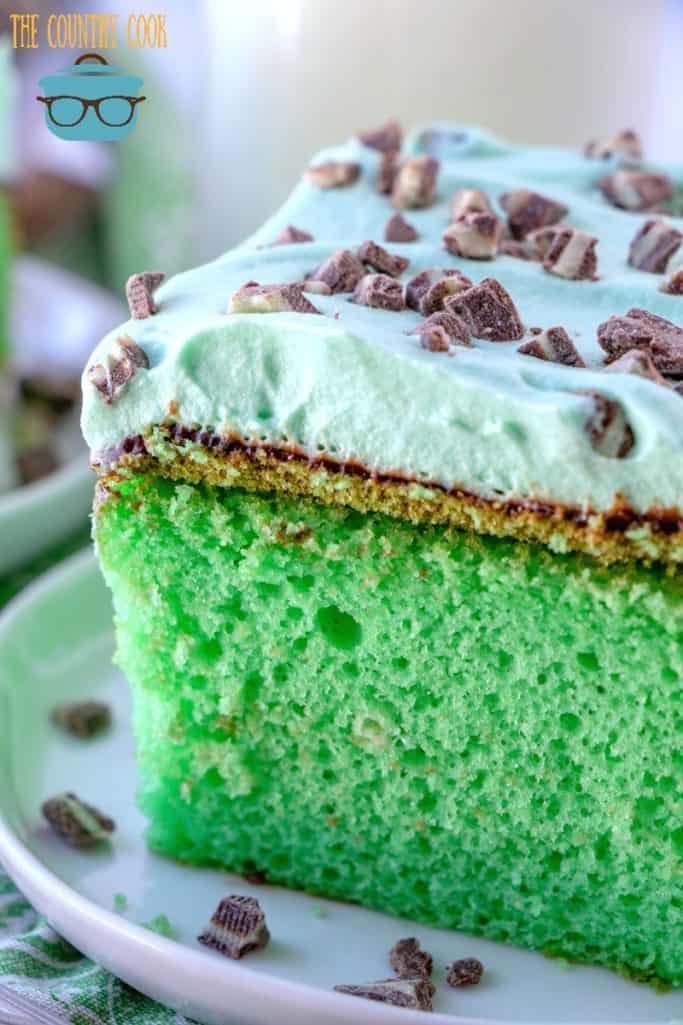 slice, green mint grasshopper cake topped with Andes creme de menthe chocolate pieces.