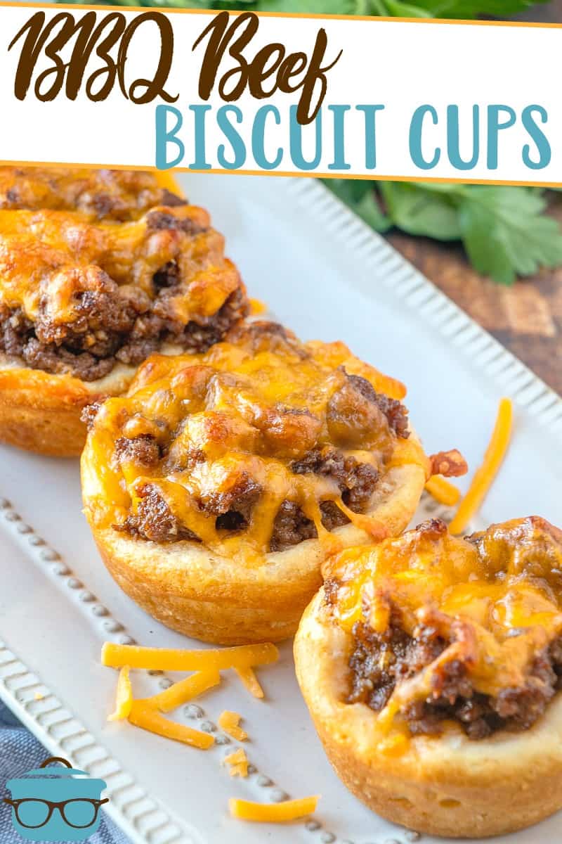 Easy BBQ Beef Biscuit Cups recipe from The Country Cook shown lined up on a white platter.