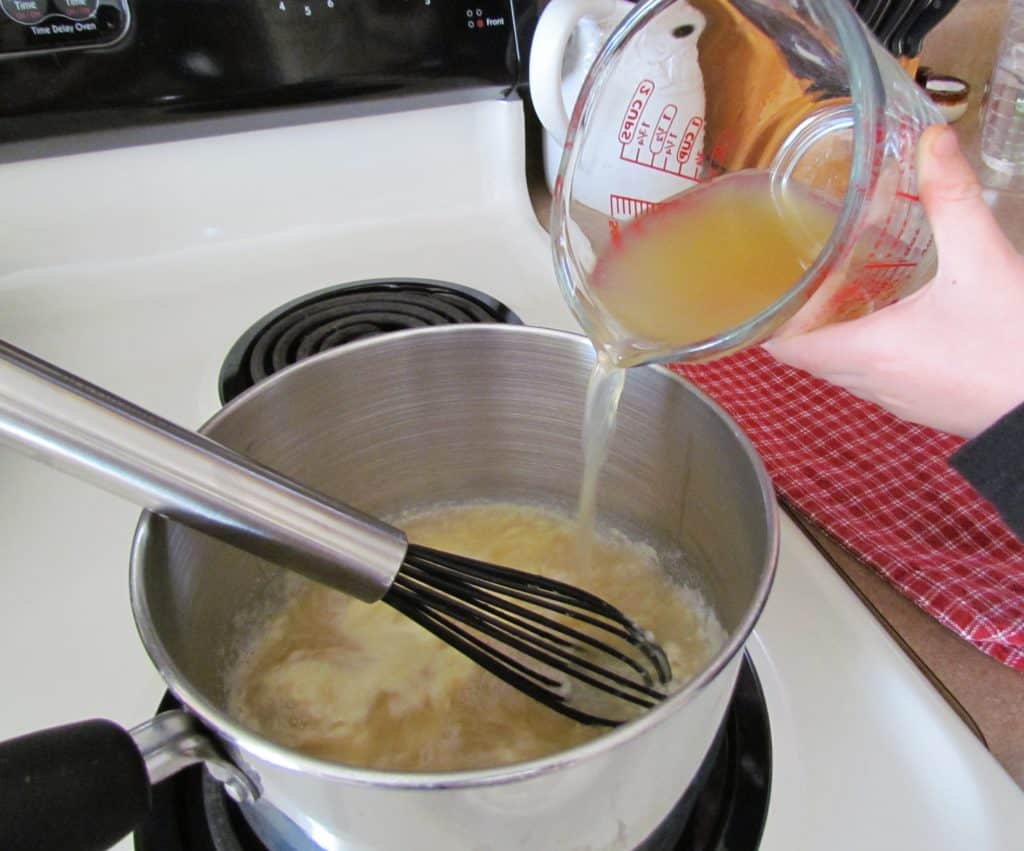 making a roux with flour, butter and chicken broth