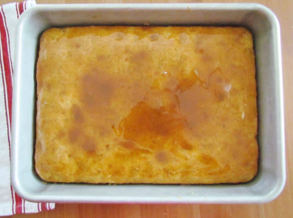 drizzled caramel sauce on warm apple cake