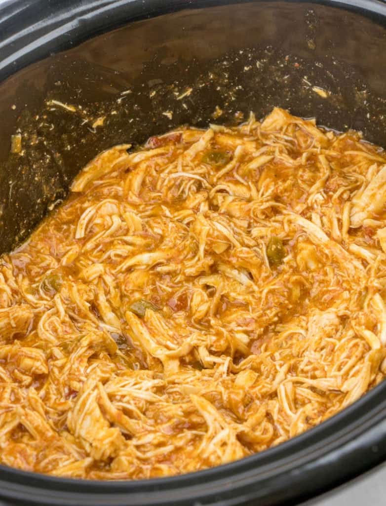 shredded taco chicken in a slow cooker