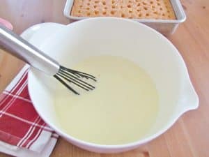 whisking together milk and instant pudding.