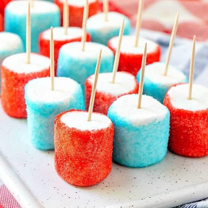 Patriotic Jell-O Marshmallows with toothpicks on a plate