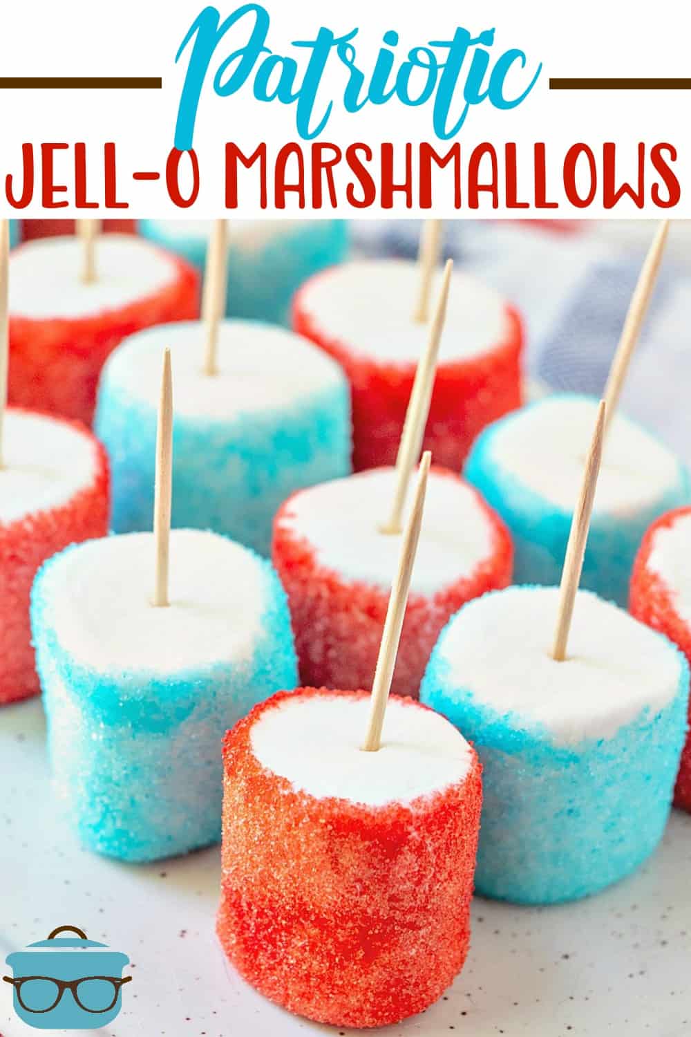 Patriotic Jell-o Marshmallows recipe from The Country Cook shown lined up on a white tray.