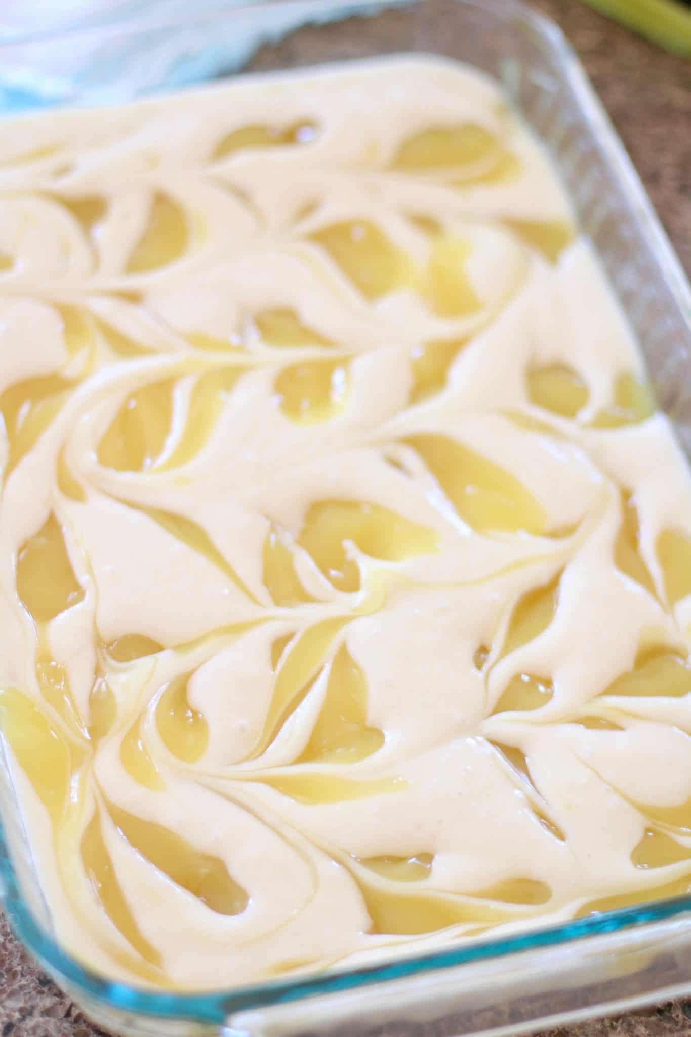swirled lemon cake before baking in a clear baking dish.