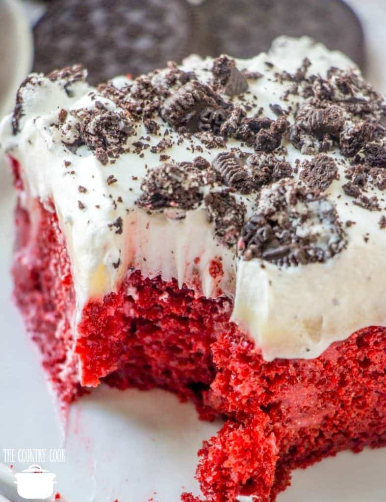 slice, Easy Red Velvet Pudding Poke Cake topped with Oreos